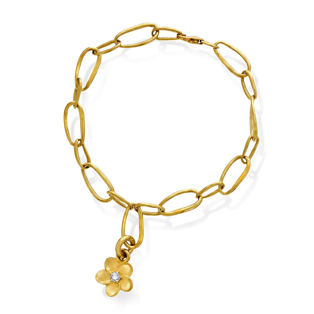 Armbånd i 585 gult gull med diamant 0,03 ct og blomst