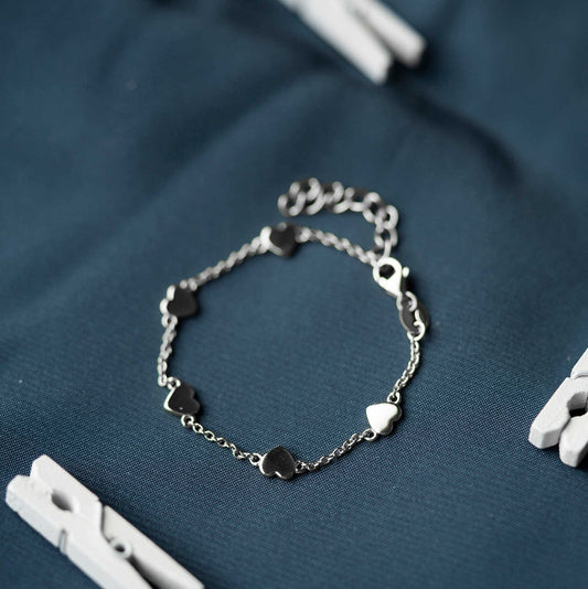 ARMBÅND I SØLV HJERTER 25286